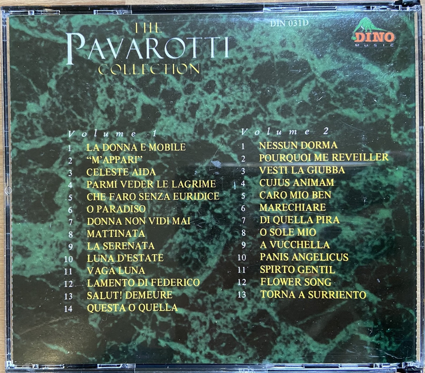 CD cover of 'The Pavarotti Collection' with album tracklist on a green marble background