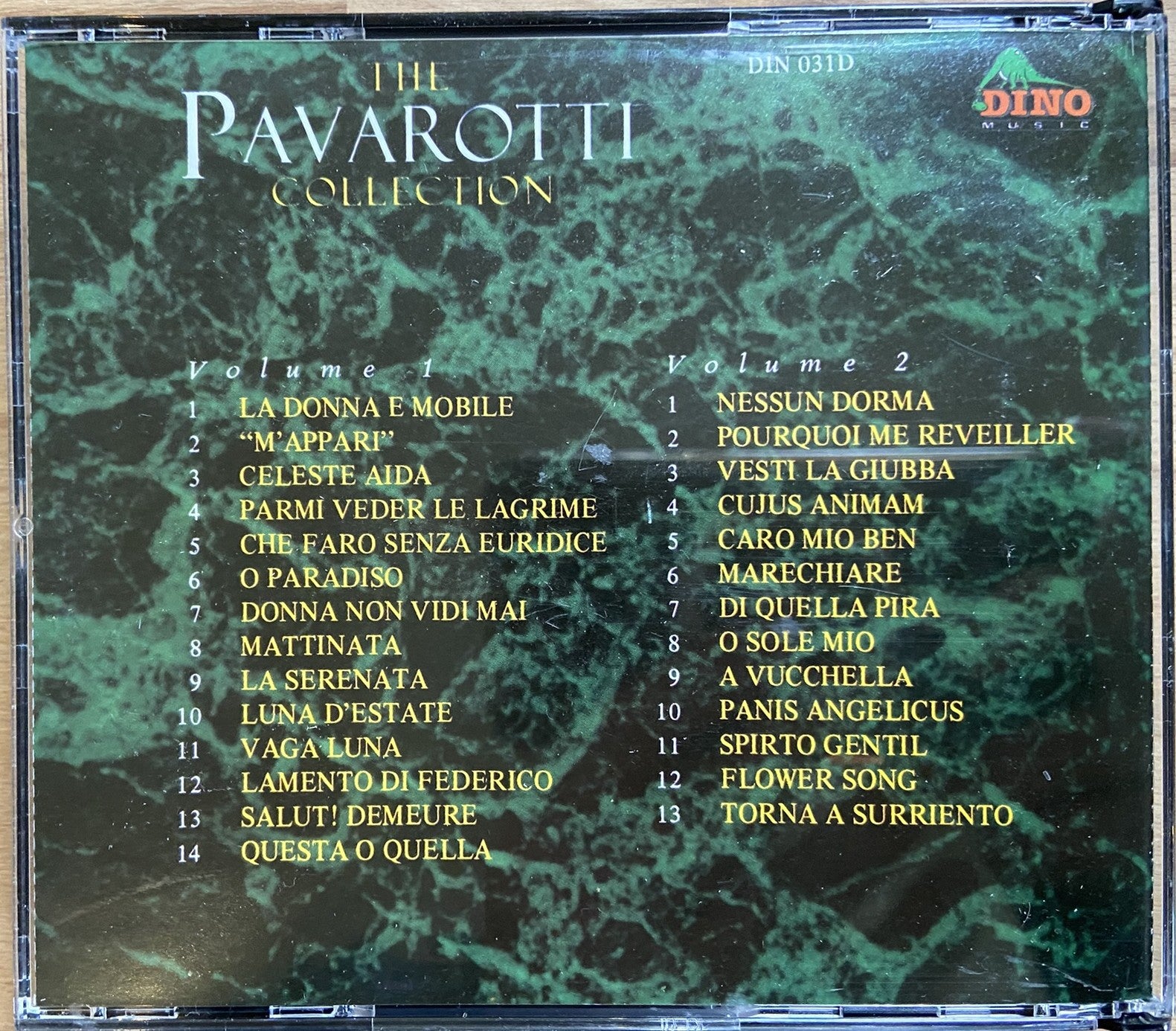 CD cover of 'The Pavarotti Collection' with album tracklist on a green marble background