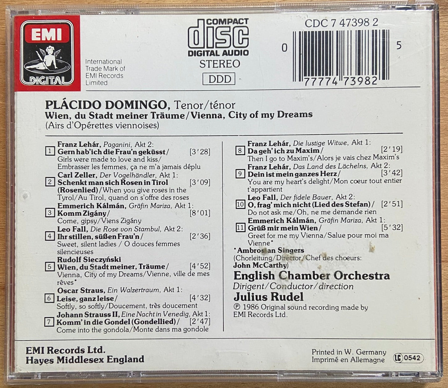 Back cover of a CD with EMI branding on a wooden surface